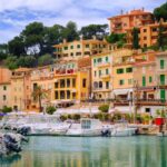 motor_boats_and_traditional_houses_in_puerto_soller_mallorca_spain_26515752726.jpg