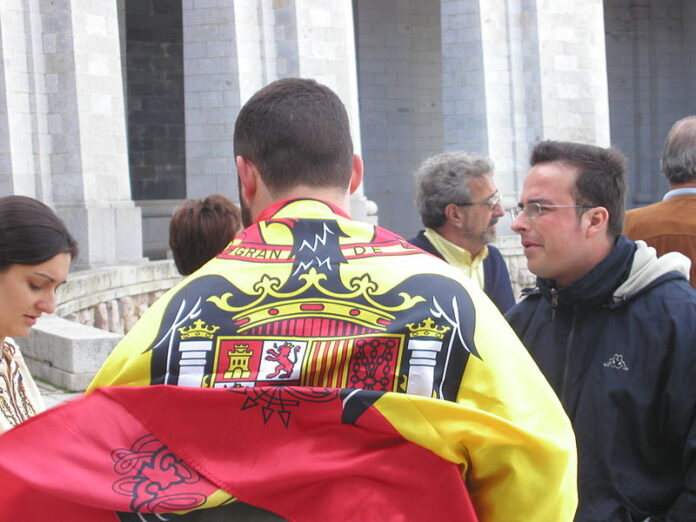 El_Valle_de_los_Caidos,_Spain,_visitors_sporting_a_flag_of_Spain_under_Francisco_Franco_(2)