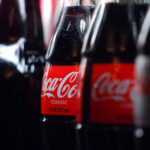401px-Coca-Cola_bottles (CROP)