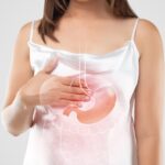 A woman suffering from gastroesophageal reflux disease